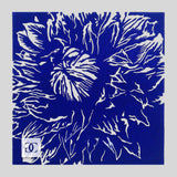 Purple hand-carved and hand-printed linocut relief print. Close up art of a clematis flower bloom with detailed petals.